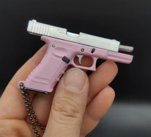 Bling or Bang? Decoding the Appeal of Gun Keychain Accessories