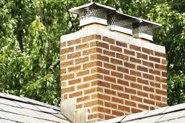 Choosing the Right Chimney Cap: Materials, Styles, and Considerations